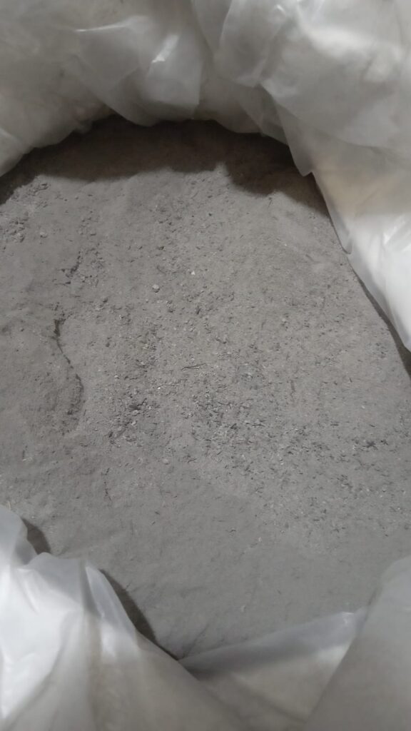 Close-up of premium Palm Oil EFB Ash powder showing fine particle mesh and uniform dry texture